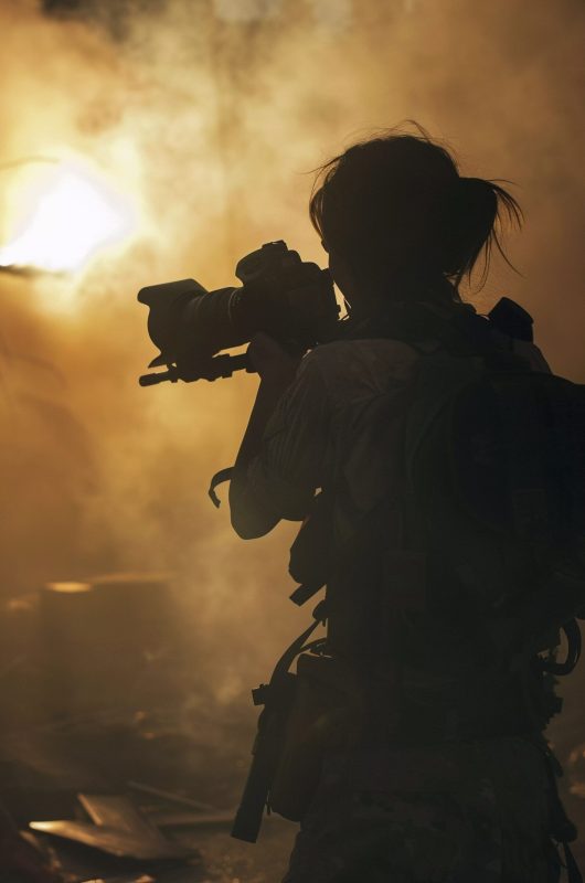 person-documenting-war-conflict-zone-through-photography